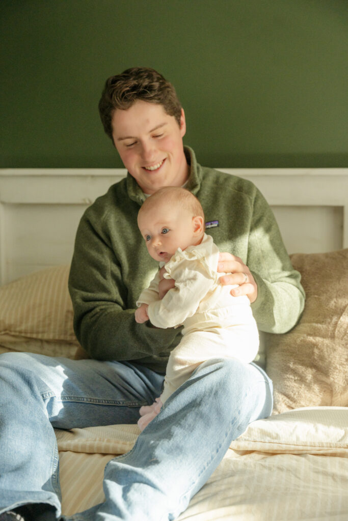 cozy in home session, dad and baby girl