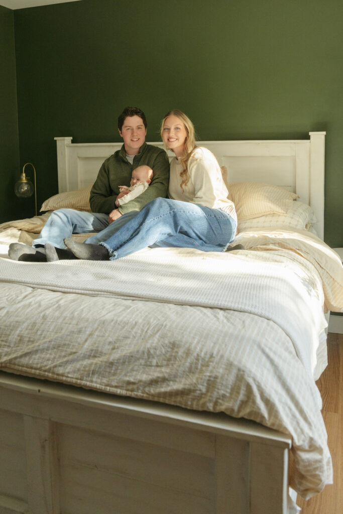 mom dad and baby in home session